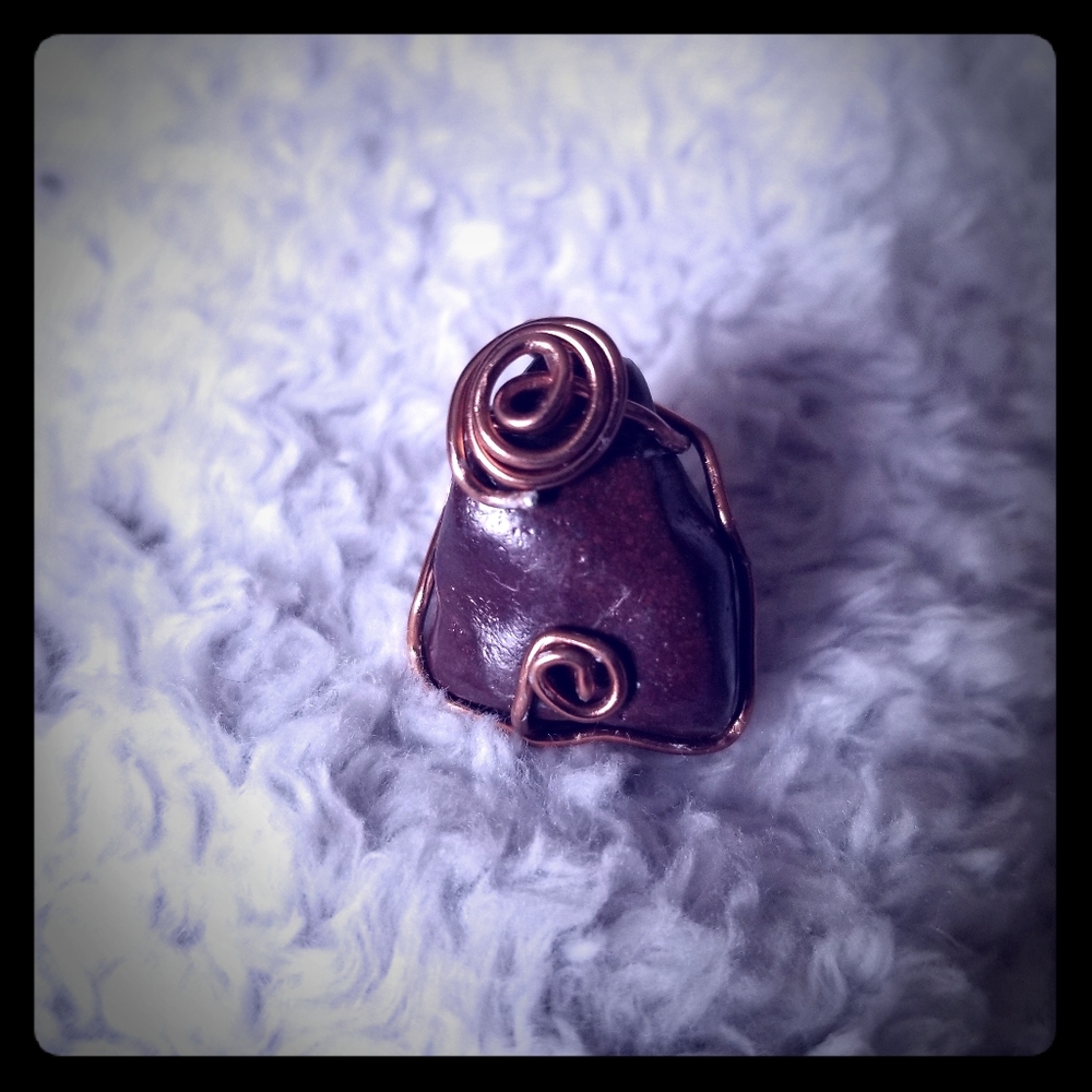 A Red Jasper wired wrapped stone